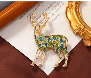 Chic Christmas elk brooch with blue green enamel and sparkling rhinestones for winter fashion.