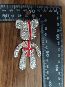 Rhinestone teddy bear brooch with UK flag design, stylish crystal lapel pin accessory for apparel.