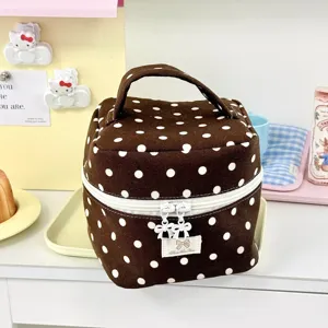 Bruine make-up tas met stippen detail, draagbare reistoilettas organizer voor dames.