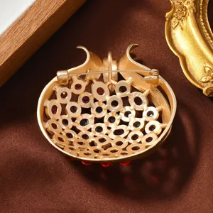 Vintage matte gold pomegranate brooch pin pendant with red gemstone hollow design.