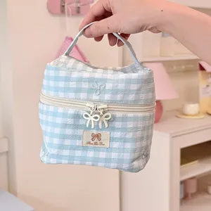 Blue plaid bow cosmetic bag, portable toiletry and makeup storage organizer with double zipper.