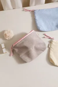Corduroy cosmetic bag detail, solid color retro portable travel makeup storage pouch zipper.