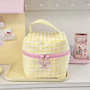 Korean style yellow plaid cosmetic bag with cute bow zipper, portable travel makeup storage pouch.