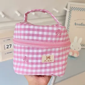 Pink gingham cosmetic bag with bow embroidery, portable makeup organizer with zipper.
