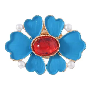 Retro blue flower brooch with red center stone and white pearls for vintage outfit decor