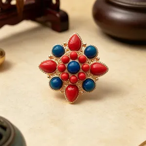 Spilla stile etnico loto vintage pietra rossa blu corsetto metallo dorato fermaglio.