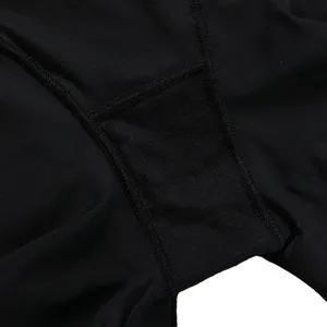 Seamless high-waisted tummy control shapewear panty detail view, breathable black shaping fabric.