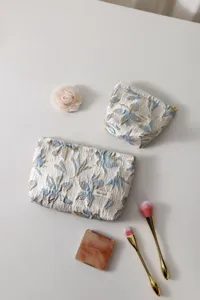 Floral jacquard cosmetic bag set, elegant makeup pouch with zipper for daily storage.