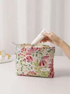 Floral embroidered cosmetic bag with zipper, portable travel makeup pouch for toiletries.