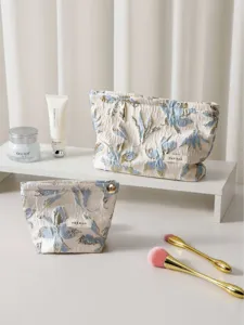 Gold thread jacquard cosmetic bag set, elegant floral design, portable and large capacity.
