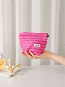 Bolsa cosmética de rayas rosas con cremallera, organizador de maquillaje portátil para uso diario.