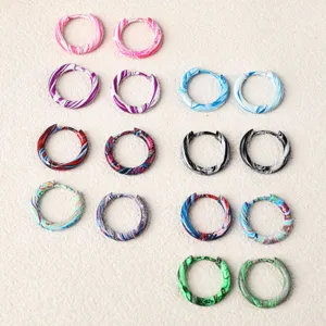 Colorful stainless steel marbled enamel huggie hoop earrings detail view, multi-color.