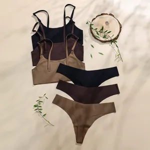 Women plus size wireless bra and low waist thong underwear set in neutral colors flat lay main image