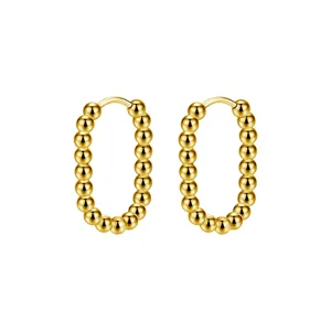 Detailed view of elegant gold beaded hoop earrings, minimalist round ball ear buckles.