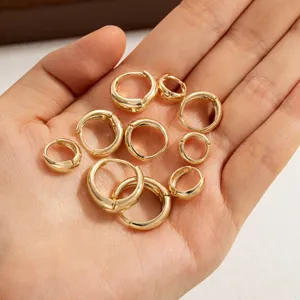 Set of multiple gold-colored stainless steel hoop earrings in various sizes for daily wear.