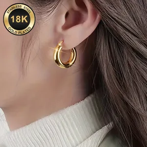 Stainless steel 18K gold plated hoop earrings detail view, minimalist style jewelry close-up.