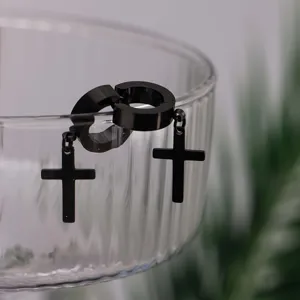 Black stainless steel cross hoop earrings detail shot, stylish jewelry for men and women.
