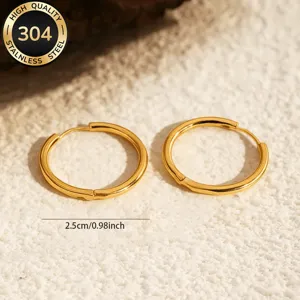 Gold plated stainless steel hoop earrings, minimalist 2.5cm circular design for daily wear.