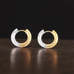Stainless steel two tone hoop earrings detail shot showing the modern round geometric design.