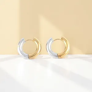 Two-tone thick stainless steel hoop earrings, modern minimalist geometric gold silver design.