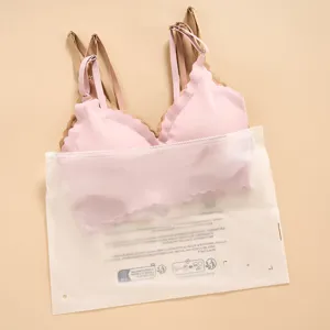 Seamless wireless bra set in pink and nude with adjustable straps and frosted storage bag.