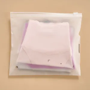 Detail shot of women's scalloped edge panties in frosted ziplock packaging bag.
