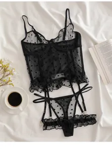 Black mesh lingerie set detail, sheer cami and garter thong with cute heart pattern.