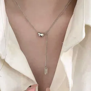 Minimalist S925 sterling silver bean pendant Y-shaped necklace chic clavicle chain with lucky tag.