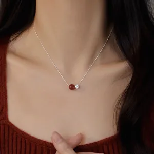 Detailed view of the elegant S925 silver red agate bead pendant necklace for women.