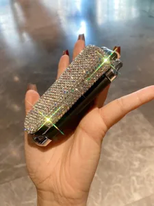 Close-up detail view of a dazzling rhinestone folding pocket comb with mirror for women travel.