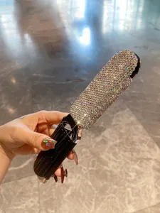 Mini portable rhinestone folding hair brush with mirror compact pocket comb for women.
