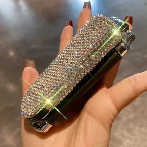 Mini portable rhinestone folding hair brush with mirror, compact dual-use cosmetic tool for women.
