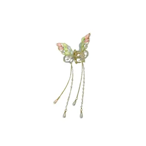 Elegant butterfly hair claw clip with crystal rhinestones and pearl tassel charms for women.