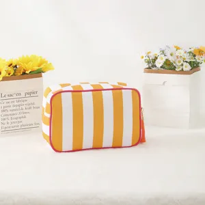 Yellow white striped cosmetic bag waterproof travel makeup bag with tassel for women daily use.