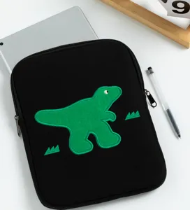 Cute embroidered dinosaur black tablet sleeve detail showing cute green motif and zipper closure.