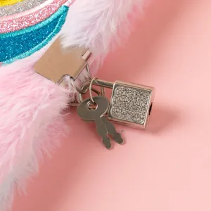 Plush unicorn notebook with secure metal lock detail close up, pink diary for girls.