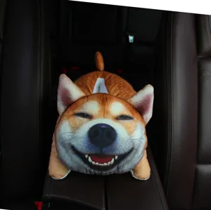 Detail shot of a cute 3D cartoon dog tissue box placed neatly on a car armrest console.