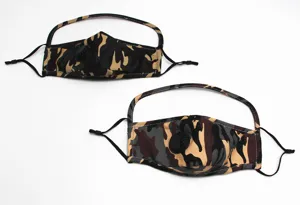 Detailed view of camouflage dust face mask with breathing valve and comfortable head strap.