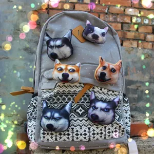 Grey canvas backpack with funny 3d dog head plush badges, casual cute detail view design.
