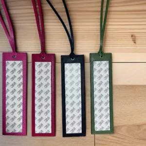 PU leather cross stitch bookmark set with lanyard and adhesive backing, multi-color DIY craft display.
