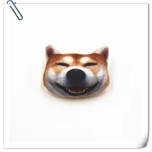 Close-up detail of 3D Shiba Inu head plush brooch badge, cute animal apparel accessory.