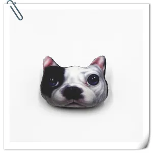 Close-up detail of the 3D cartoon dog head plush brooch, cute animal badge and accessory.