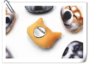 Detailed view of 3D cartoon dog plush brooch, showing metal pin back and cute animal face.