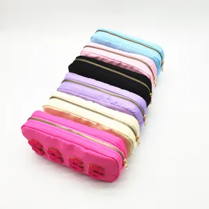Colorful nylon cosmetic bag with golden zipper and fuzzy letter patches, large storage travel pouch.