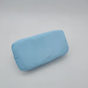 Light blue nylon cosmetic bag detail, portable travel makeup pouch, daily storage organizer.