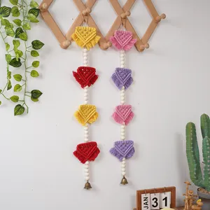 Nordic bohemian macrame wall hanging with wooden beads tassels and bells for kids room decor.