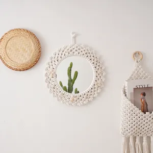 Nordic handmade woven cotton rope mirror wall decor detail, boho chic hanging makeup mirror.