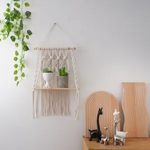 Bohemian woven wall hanging shelf with wooden board and cotton rope for home room decor.