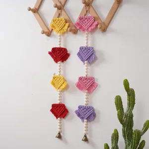 Nordic bohemian macrame wall hanging with wooden beads tassels and bells for kids room decor.