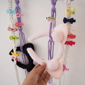 Bohemian macrame hair clip holder wall hanging organizer with cute hairpins and headbands.